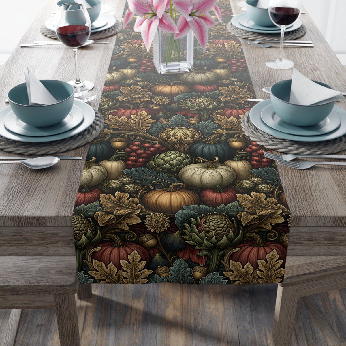 a table setting with a table runner decorated with a fall-themed print of pumpkins, leaves, and other seasonal elements. The table is set with plates, bowls, silverware, and glasses, creating a cozy and festive atmosphere.