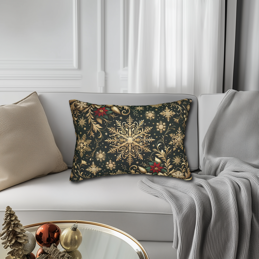 a living room with a white couch, a decorative pillow with a black and gold floral design, and a glass coffee table with ornaments.